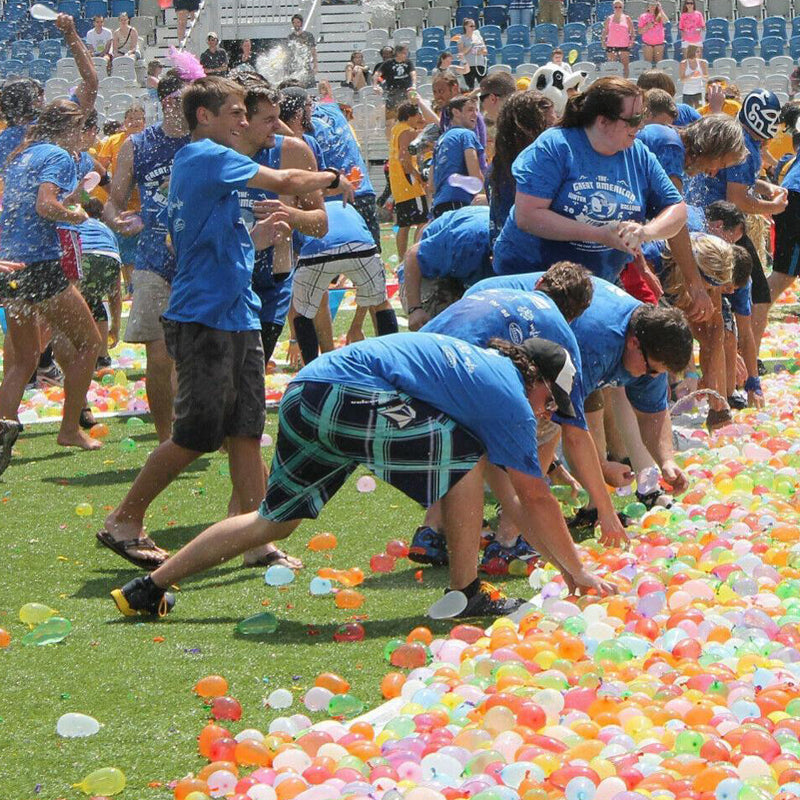 Kids having a water balloon fight